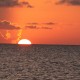 another beautiful sunset in belize while sailing near islands