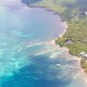 blue water and white sand aerial shot near Barrier reef in the Caribbean