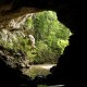 cave opening while on trip exploring mayan caves and artifacts in belize