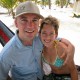 couple in hammock on south water caye belize while on catamaran charter vacation