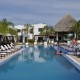 couple relax in pool at luxury resort belize