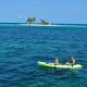 couple sea kayak belize goff's caye island exploration