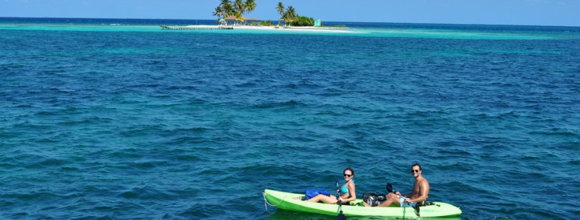 couple sea kayak belize goff's caye island exploration