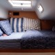 cozy bedroom bed on luxury catamaran vacation charter