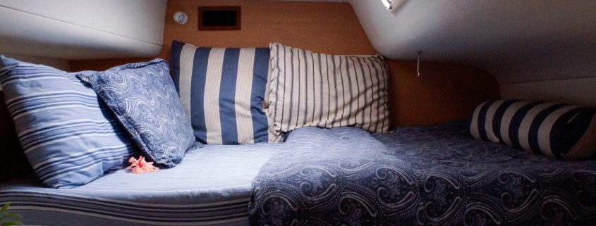 cozy bedroom bed on luxury catamaran vacation charter