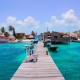 dock near tackle box in blue green waters on ambergris caye belize