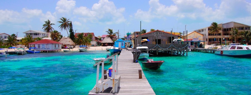 dock near tackle box in blue green waters on ambergris caye belize