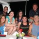 family and crew posing on private yacht vacation in belize