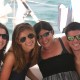 family and friends pose on catamaran charter in beautiful belize