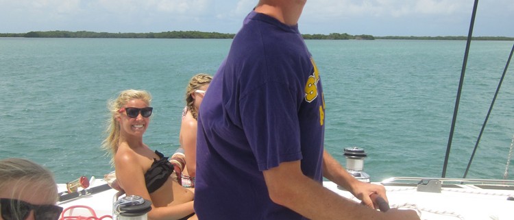 family on catamaran sailing adventure in the islands of belize