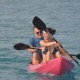 family sea kayaking in belize calm waters