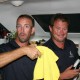 friendly crew of belize sailing vacations mixing cocktails for guests