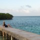 girl relaxing near split bar on caye caulker belize