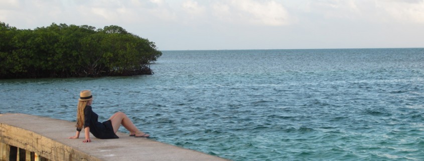 girl relaxing near split bar on caye caulker belize