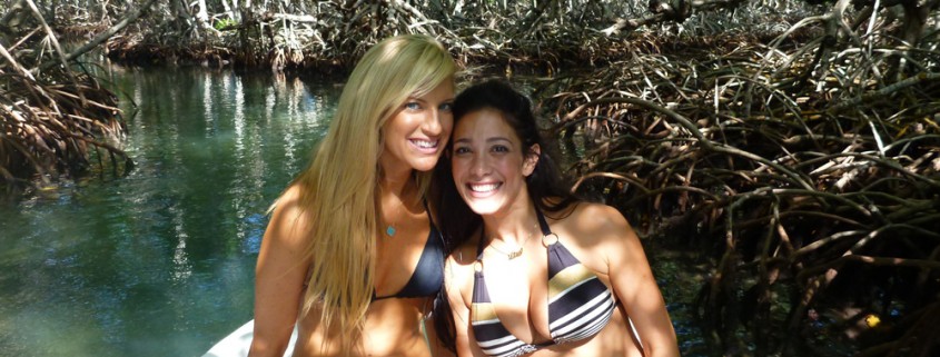 girls smiling in mangroves on an island adventure and romantic getaway.