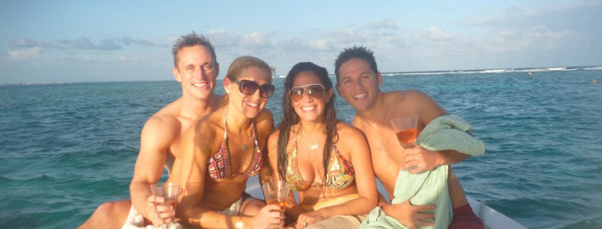 Group photo in Belize relaxing off reef fishing and snorkeling