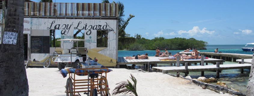 guest sun bathe and drink cocktails at the lazy lizard belize