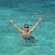 guest swimming blue waters belize while on amazing island vacation