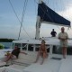 Guests on relax on luxury catamaran on vacation in Belize