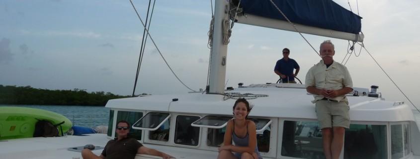 Guests on relax on luxury catamaran on vacation in Belize