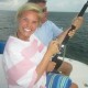 husband and wife fishing off catamaran while on family vacation with belize sailing vacations