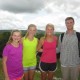 kids and family pose on top of mayan temple with vast jungle on horizon