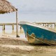 local fishing boat on beach in belize near doc