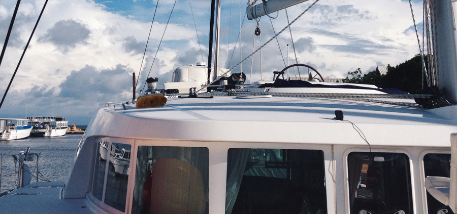 mast and cabin of luxury catamaran on charter with belize sailing vacations