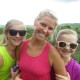 mom and daughters smile on mayan temple in belize