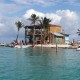 people swimming and relaxing at split bar on caye caulker belize