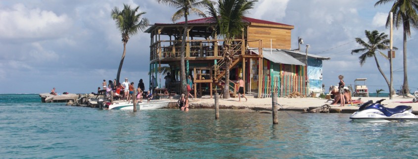 people swimming and relaxing at split bar on caye caulker belize