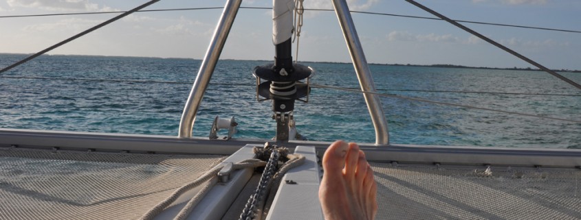 relaxing in sun on catamaran enjoying epic vacation in belize