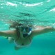 snorkeling girl in belize's clear water shallows