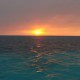 sunset belize blue water ocean reef waves