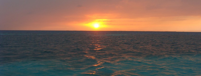 sunset belize blue water ocean reef waves