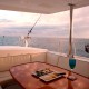 view of outside dining area on catamaran charter in belize's blue waters