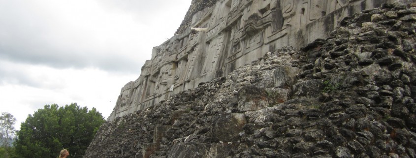 woman explores mayan temple in belize