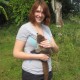 young girl holding furry animal in belize jungle